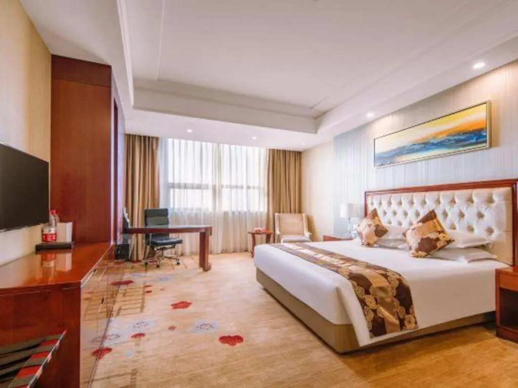 Bed in New Century Hotel Putuo Zhoushan