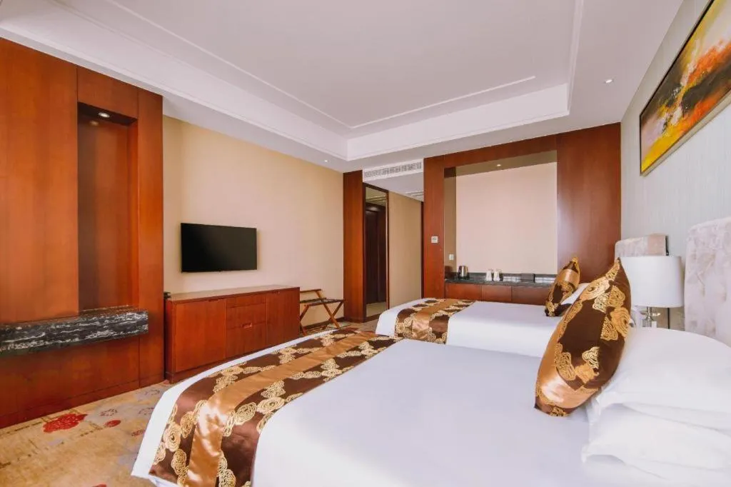 Bed in New Century Hotel Putuo Zhoushan