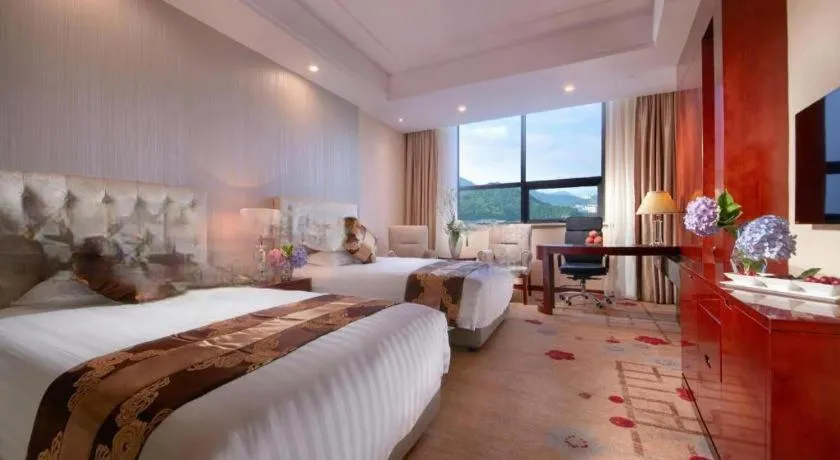 Bed in New Century Hotel Putuo Zhoushan