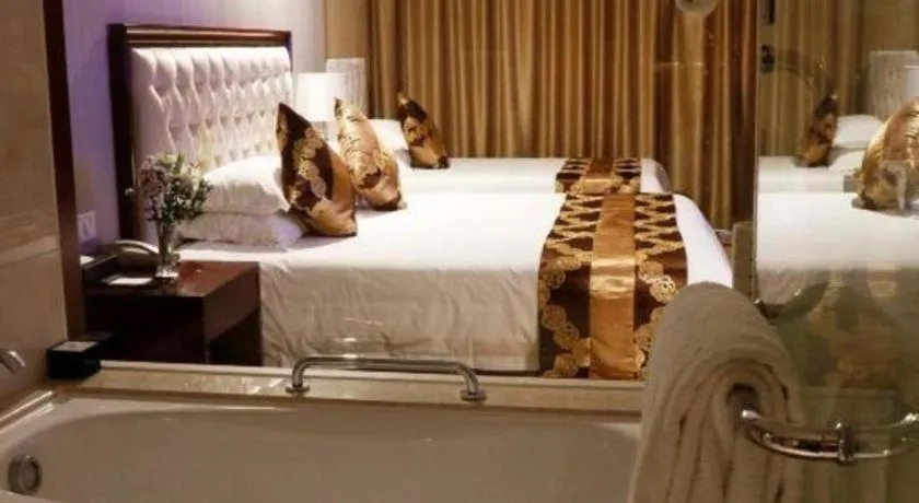 Bed in New Century Hotel Putuo Zhoushan