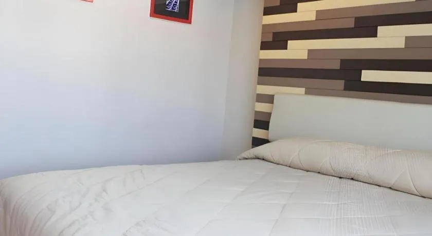 Bed in Cactus Resort & Hotel