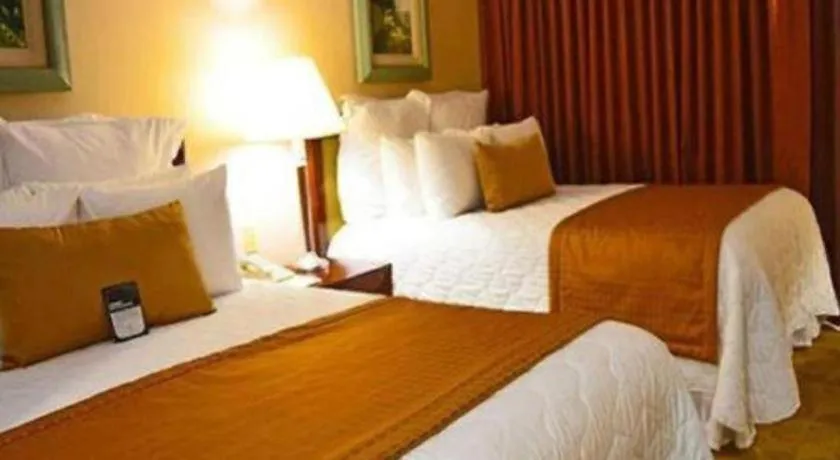 Bed in Hotel Honduras Maya