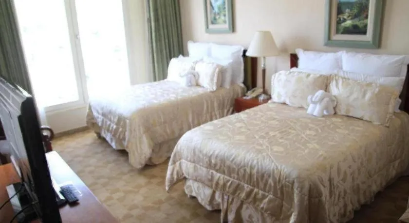 Bed in Hotel Honduras Maya