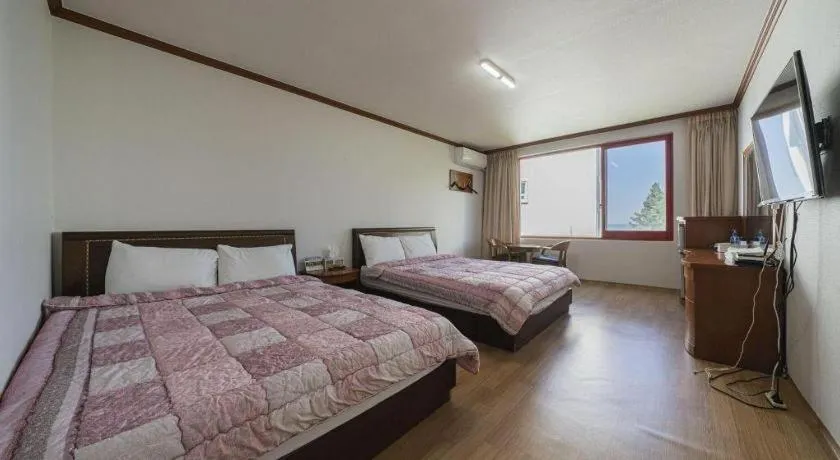 Bed in Gangneung Gyeongpodae Gangneung Motel
