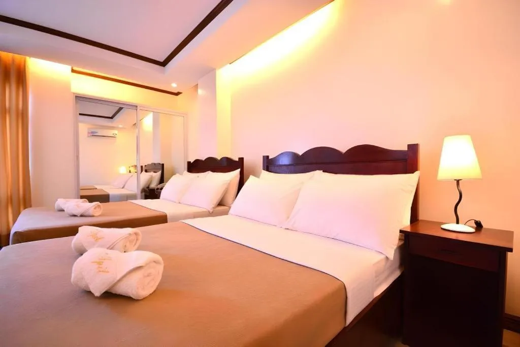 Bed in Ipil Suites Puerto Princesa