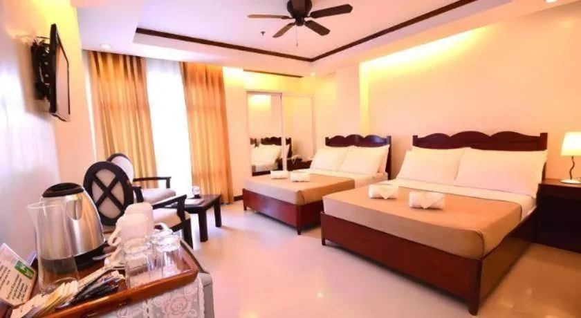 Bed in Ipil Suites Puerto Princesa