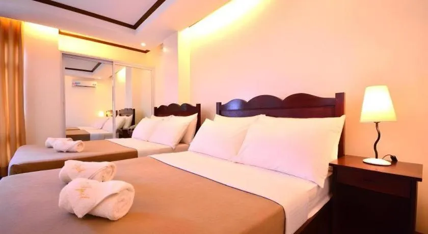 Bed in Ipil Suites Puerto Princesa
