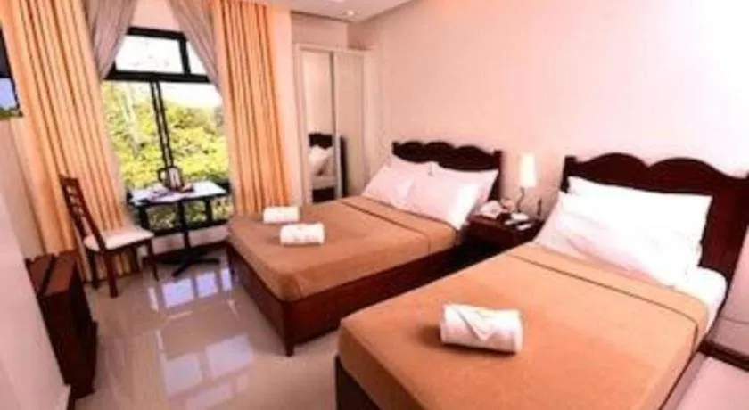 Bed in Ipil Suites Puerto Princesa