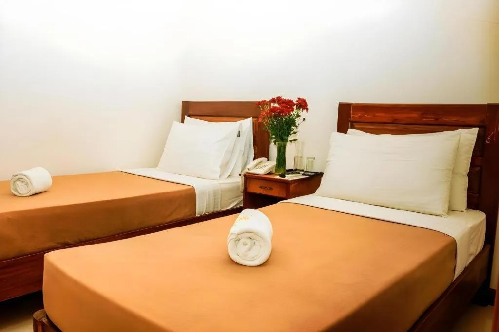 Bed in Ipil Suites Puerto Princesa