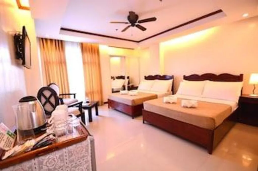 Bed in Ipil Suites Puerto Princesa