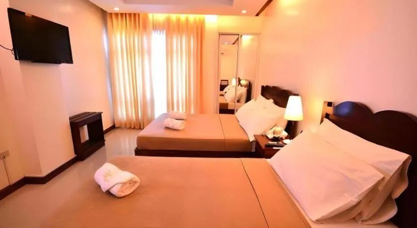 Bed in Ipil Suites Puerto Princesa