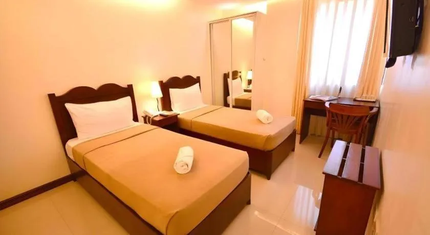 Bed in Ipil Suites Puerto Princesa