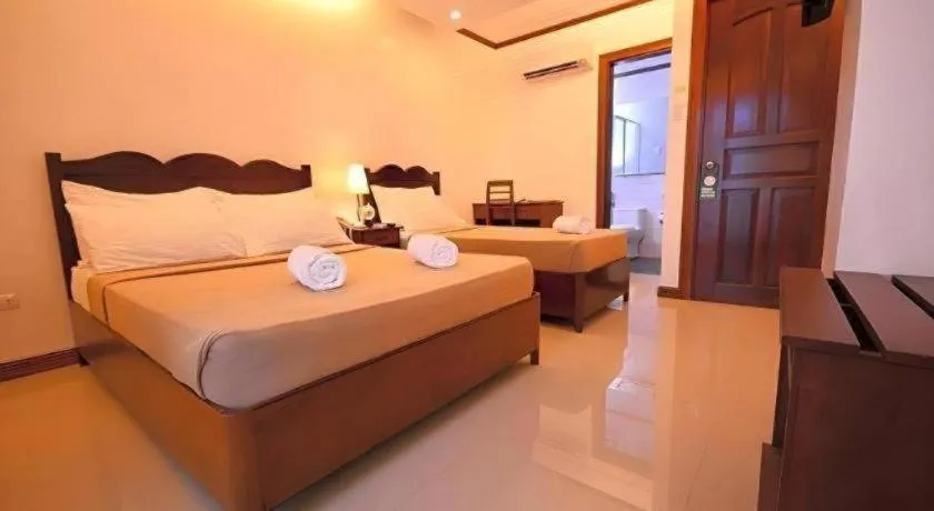 Bed in Ipil Suites Puerto Princesa