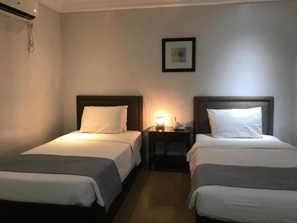 Bed in Queen Margarette Hotel