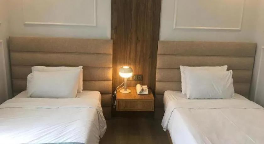 Bed in Queen Margarette Hotel