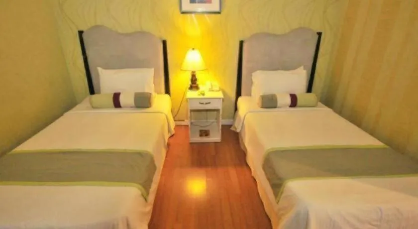 Bed in Queen Margarette Hotel