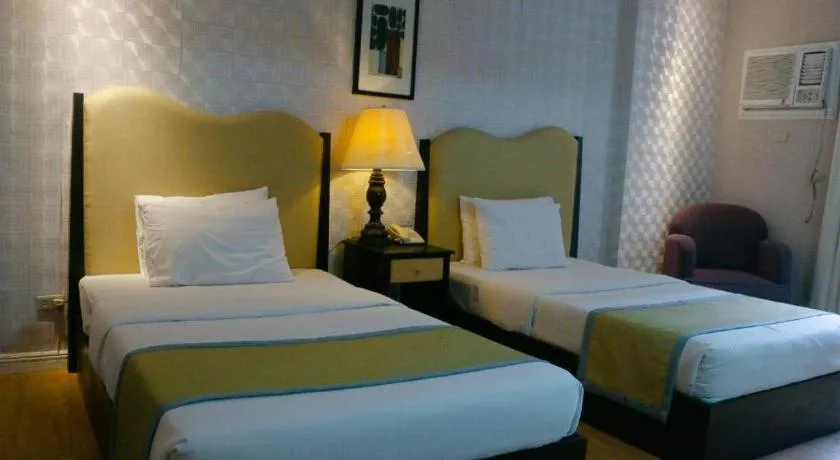 Bed in Queen Margarette Hotel