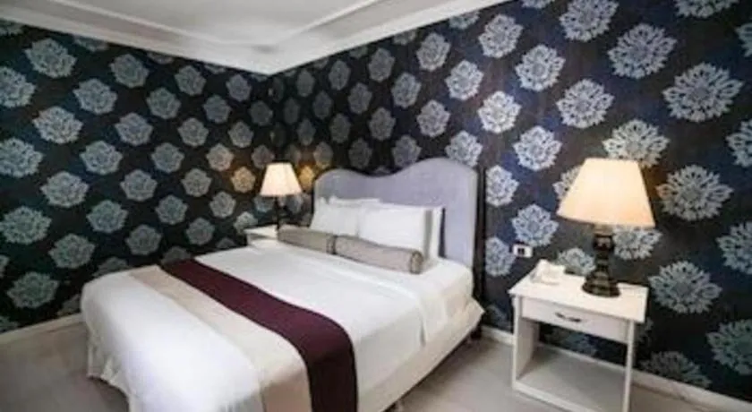 Bed in Queen Margarette Hotel