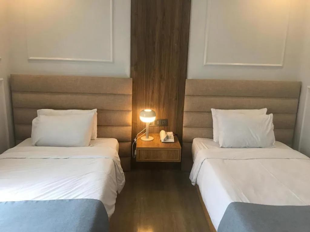 Bed in Queen Margarette Hotel