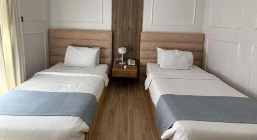 Bed in Queen Margarette Hotel