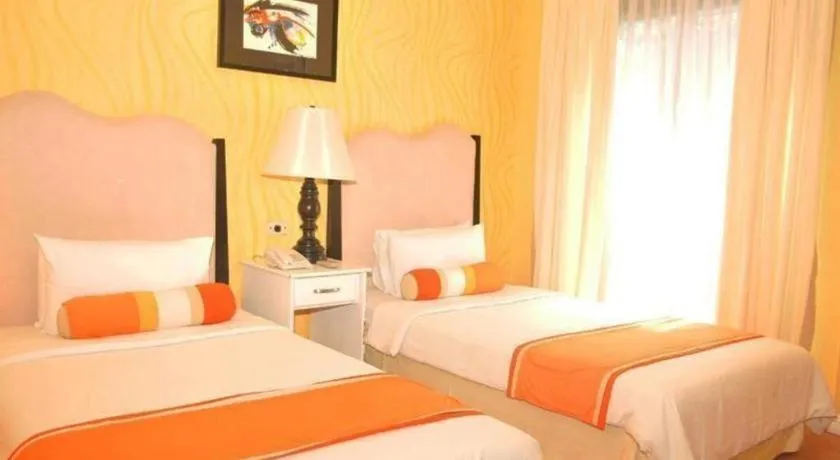 Bed in Queen Margarette Hotel