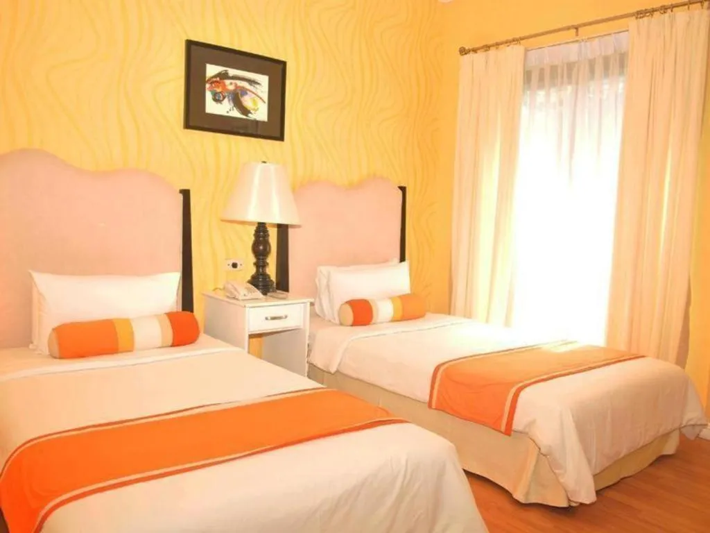 Bed in Queen Margarette Hotel