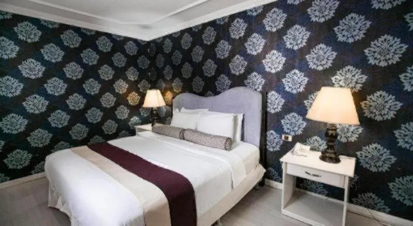 Bed in Queen Margarette Hotel