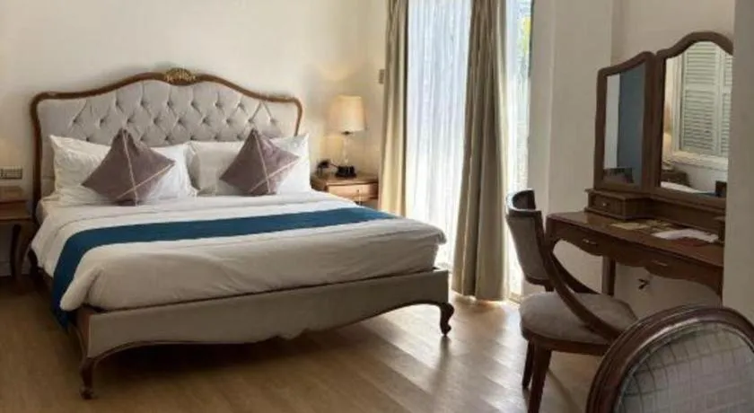 Bed in Queen Margarette Hotel