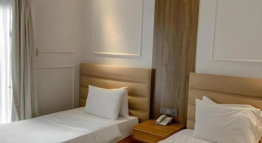 Bed in Queen Margarette Hotel