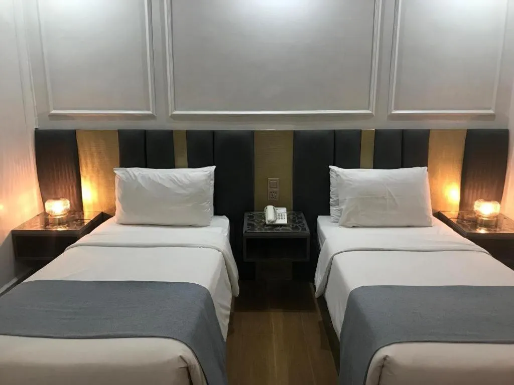 Bed in Queen Margarette Hotel