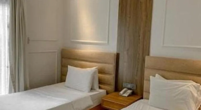 Bed in Queen Margarette Hotel