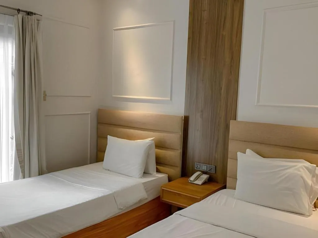 Bed in Queen Margarette Hotel