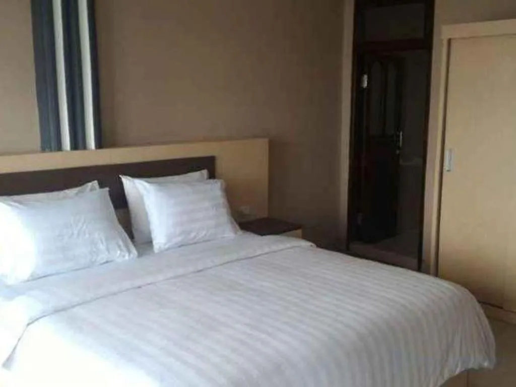 Bed in Samosir Cottages Resort