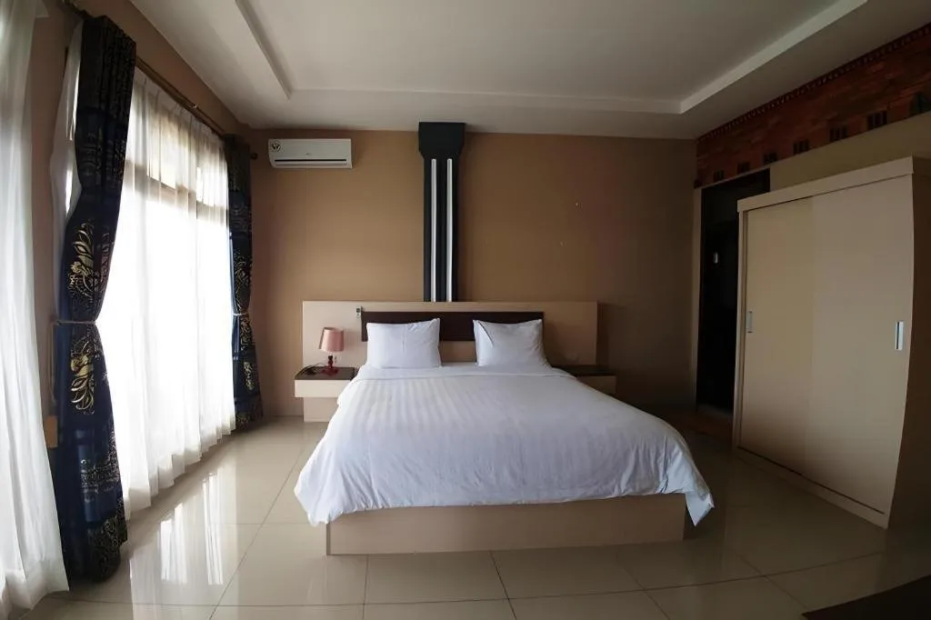 Bed in Samosir Cottages Resort