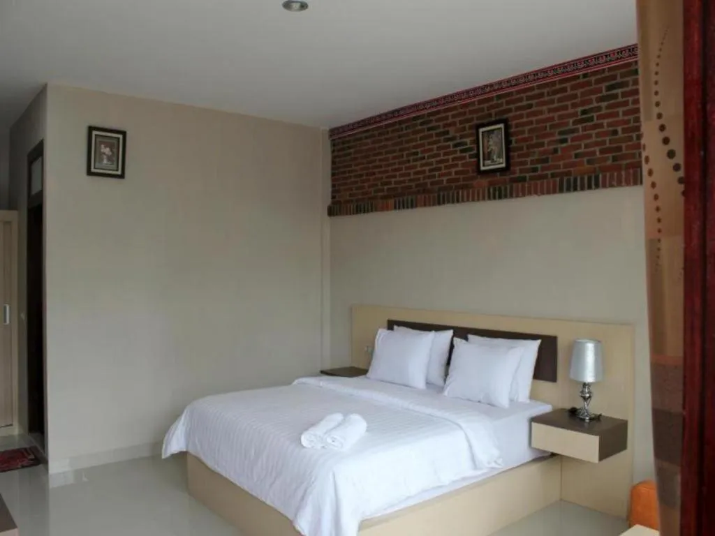 Bed in Samosir Cottages Resort