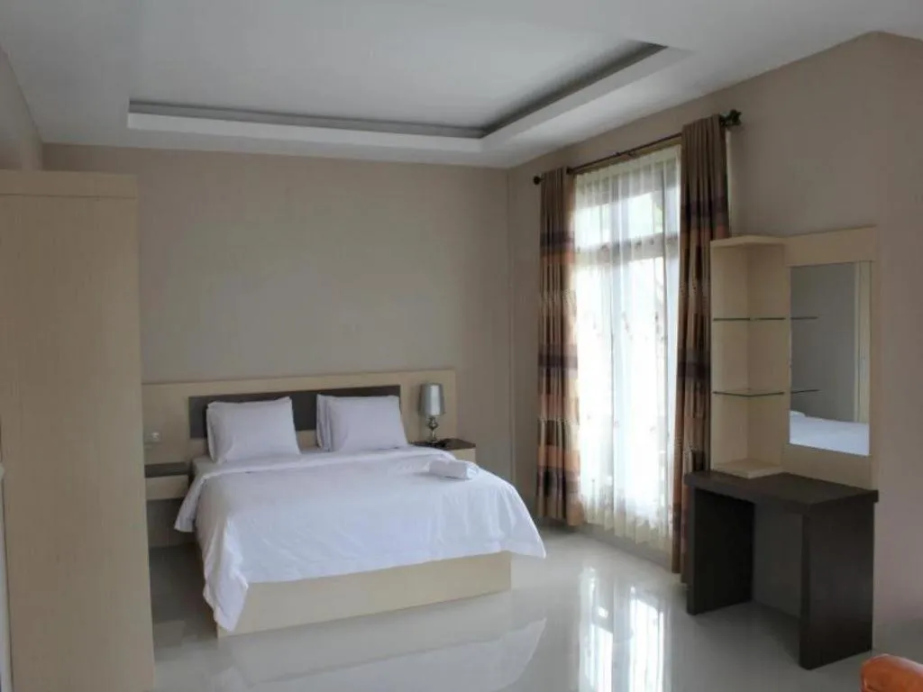 Bed in Samosir Cottages Resort