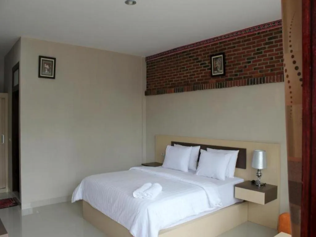 Bed in Samosir Cottages Resort