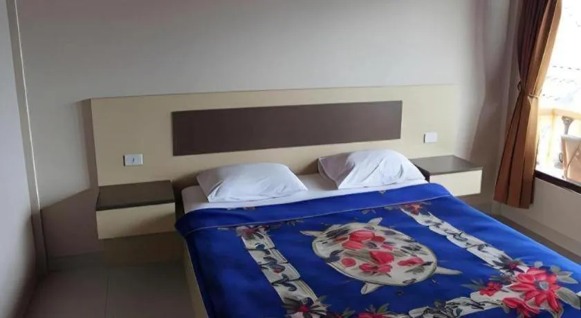 Bed in Samosir Cottages Resort