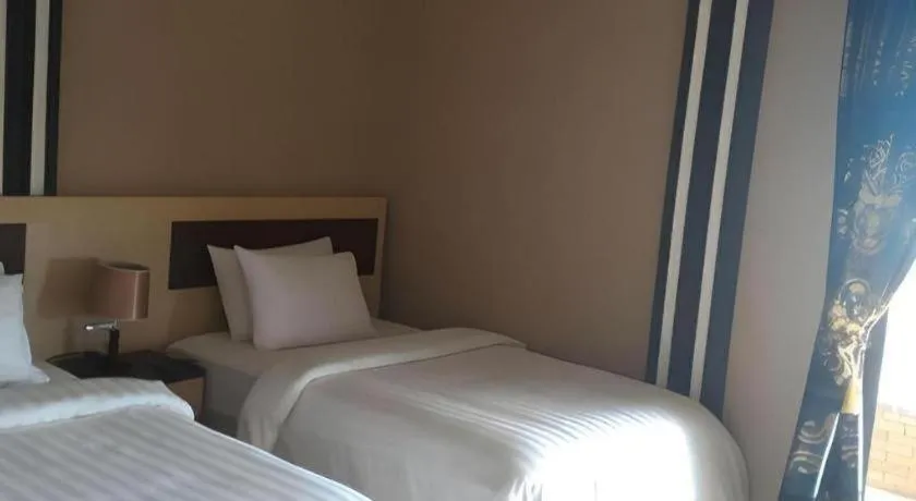 Bed in Samosir Cottages Resort