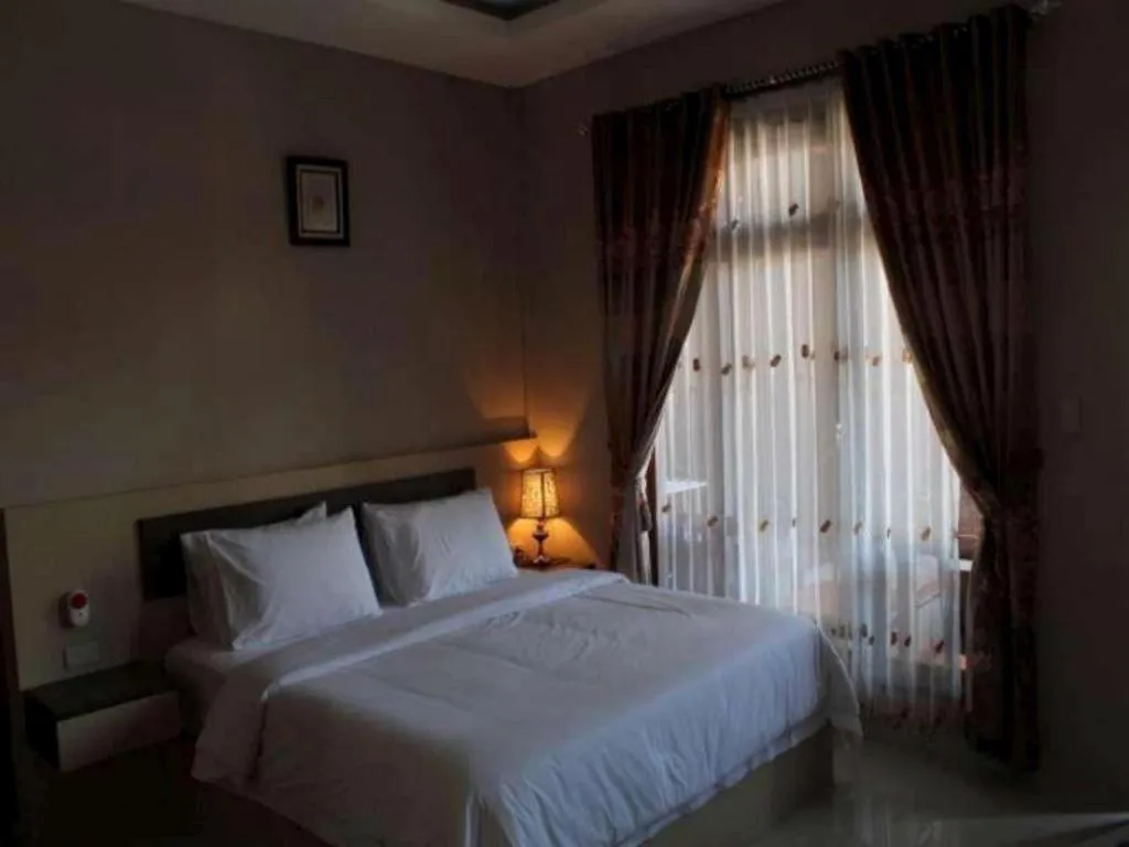 Bed in Samosir Cottages Resort