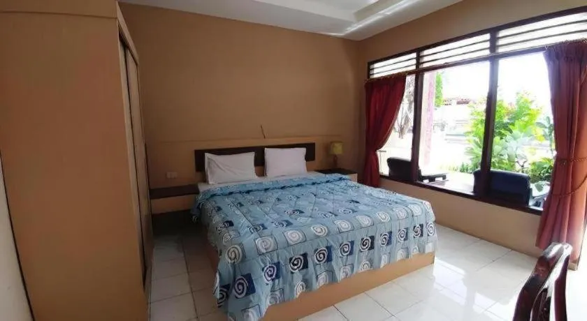 Bed in Samosir Cottages Resort