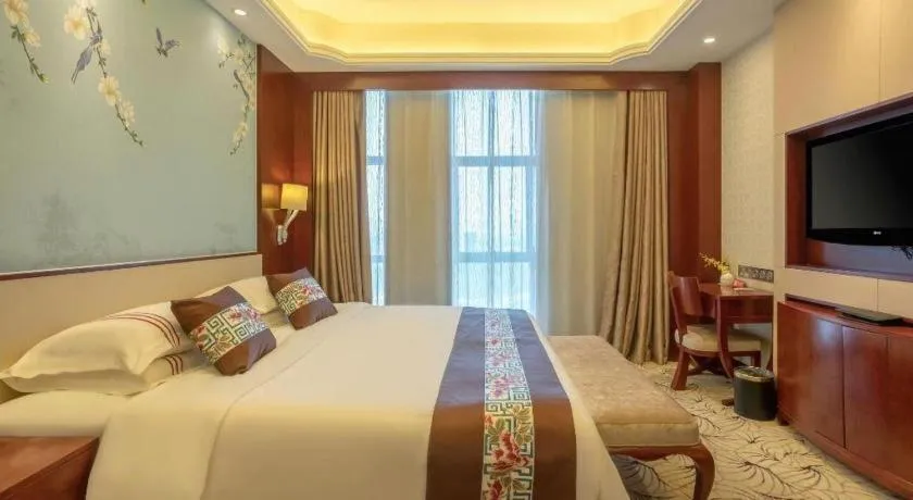Bed in Dezhou Regal Kangbo Hotel