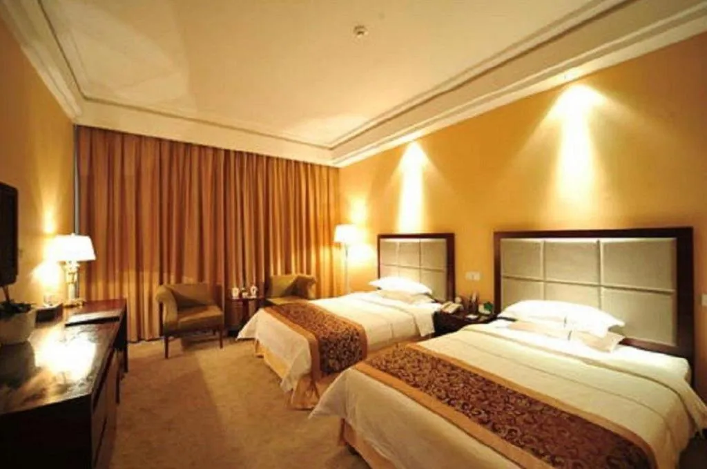 Bed in Dezhou Regal Kangbo Hotel