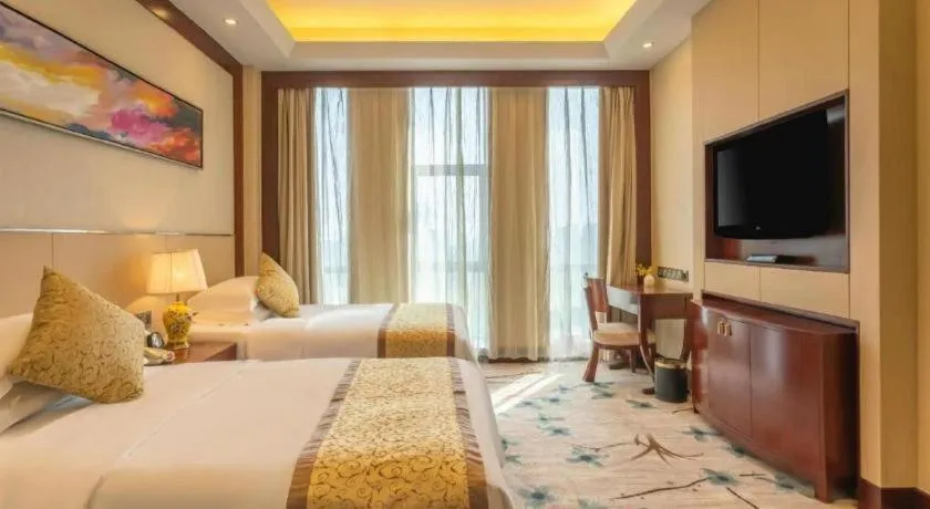 Bed in Dezhou Regal Kangbo Hotel