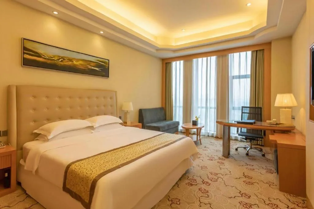 Bed in Dezhou Regal Kangbo Hotel