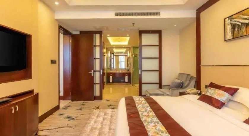 Bed in Dezhou Regal Kangbo Hotel