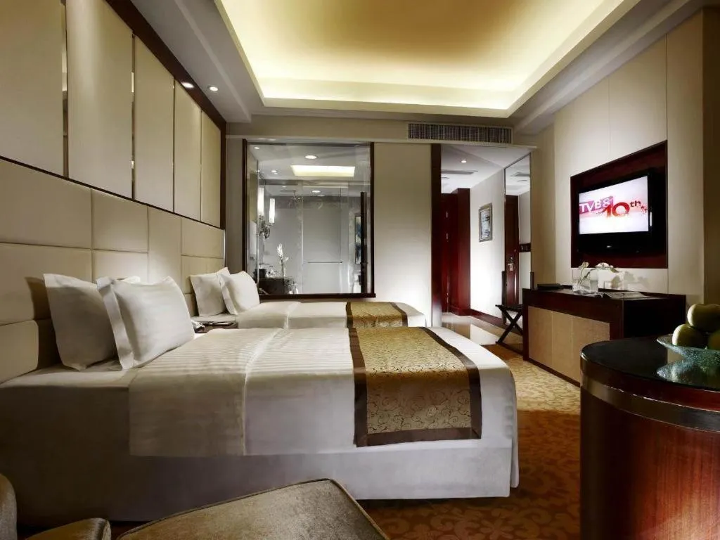 Bed in Dezhou Regal Kangbo Hotel