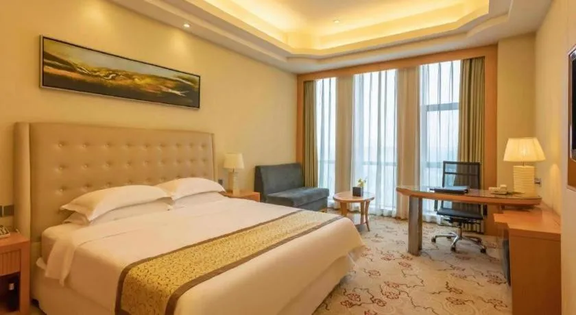 Bed in Dezhou Regal Kangbo Hotel