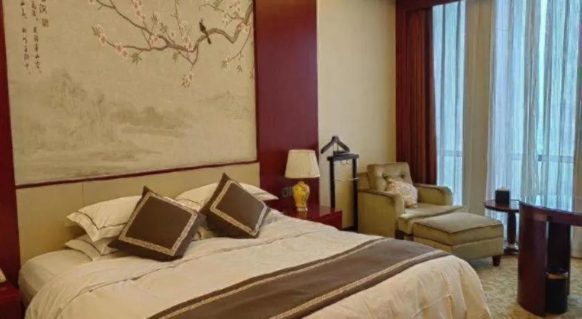 Bed in Dezhou Regal Kangbo Hotel