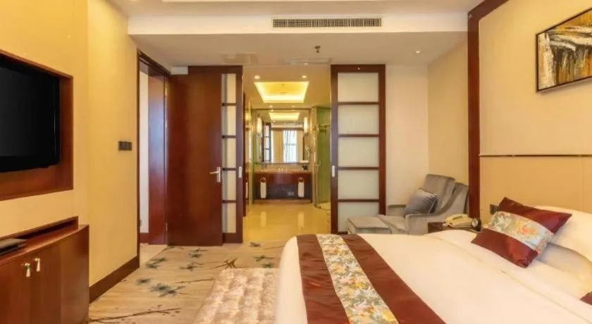 Bed in Dezhou Regal Kangbo Hotel